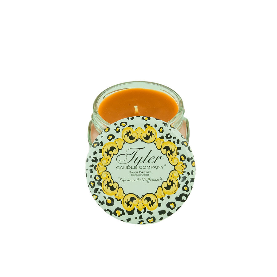Tyler Candle Company 3.4oz Cowboy candle with a leopard print lid and orange wax.