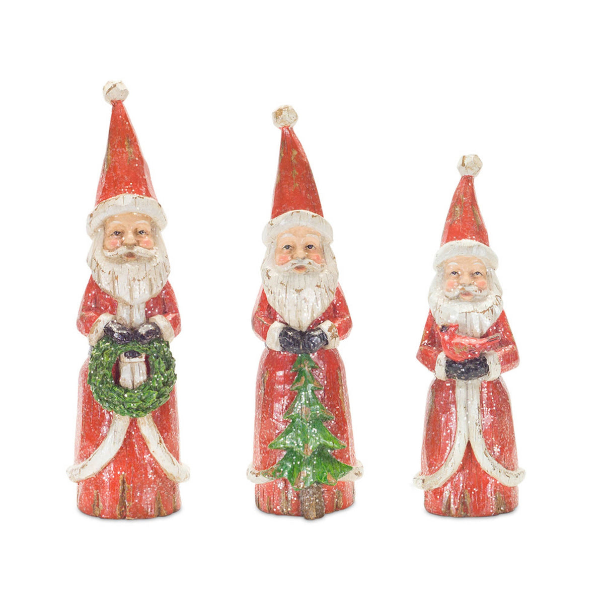 Three vintage-style resin Santa figurines in red coats holding a wreath, tree, and bird.