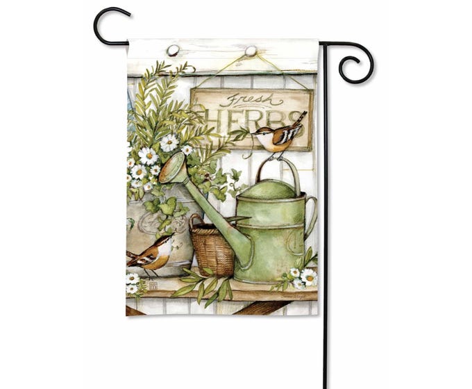 Garden flag featuring two birds, watering cans, and fresh herbs sign.