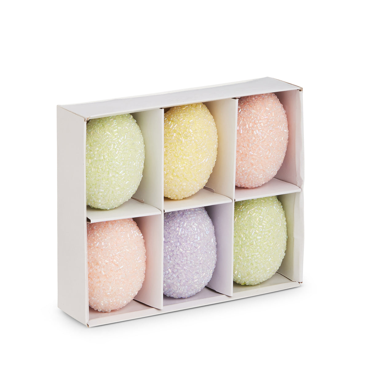 Set of six white styrofoam egg-shaped ornaments with embellished textured surfaces.