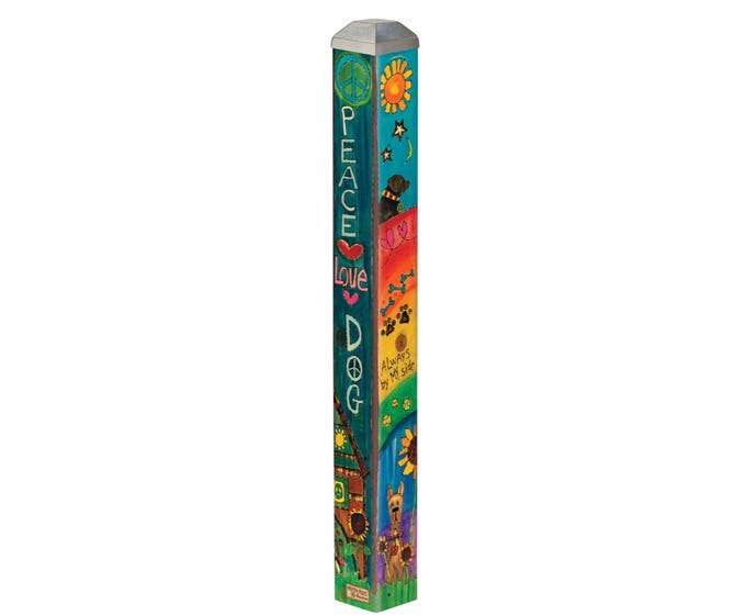 Mini art pole with a black finish and white geometric patterns on the stand.