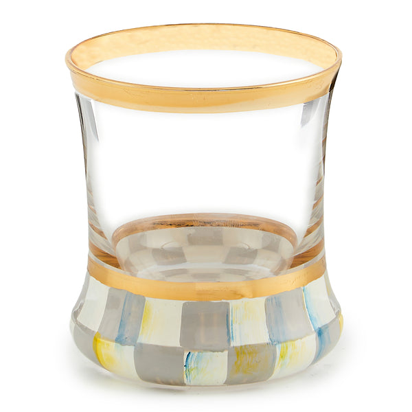 Hand-painted check shot glass with gold lustre trim on a blue base.