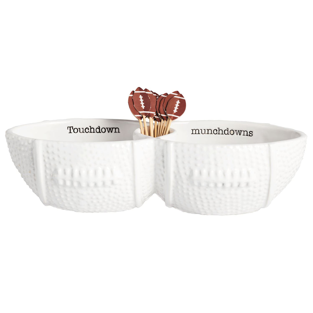 White dolomite football-shaped double server dish with toothpicks featuring football toppers.