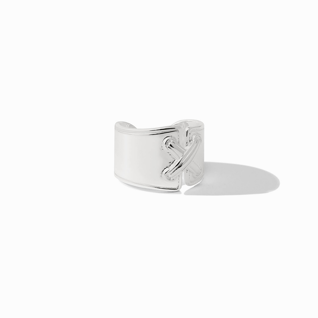 Essex Ring in silver with a wide band and a decorative cross-stitch detail on the front.