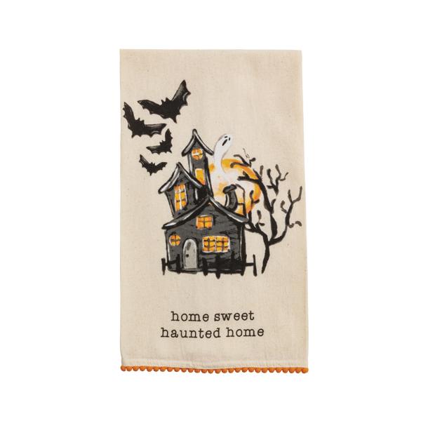 Halloween flour sack hand towel with mini pom trim in black fabric featuring orange pumpkin pattern