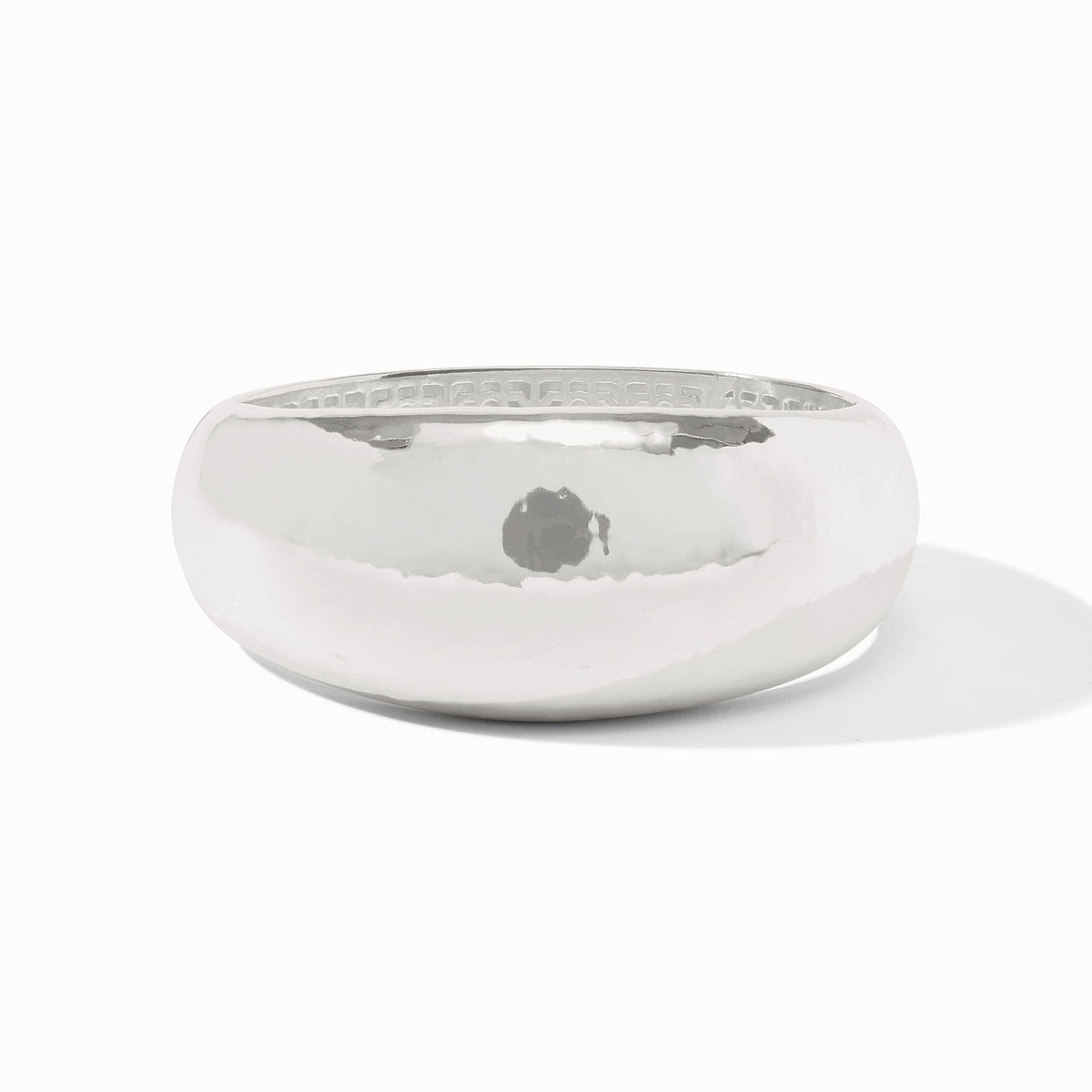 Silver plate statement bangle with a spring hinge closure