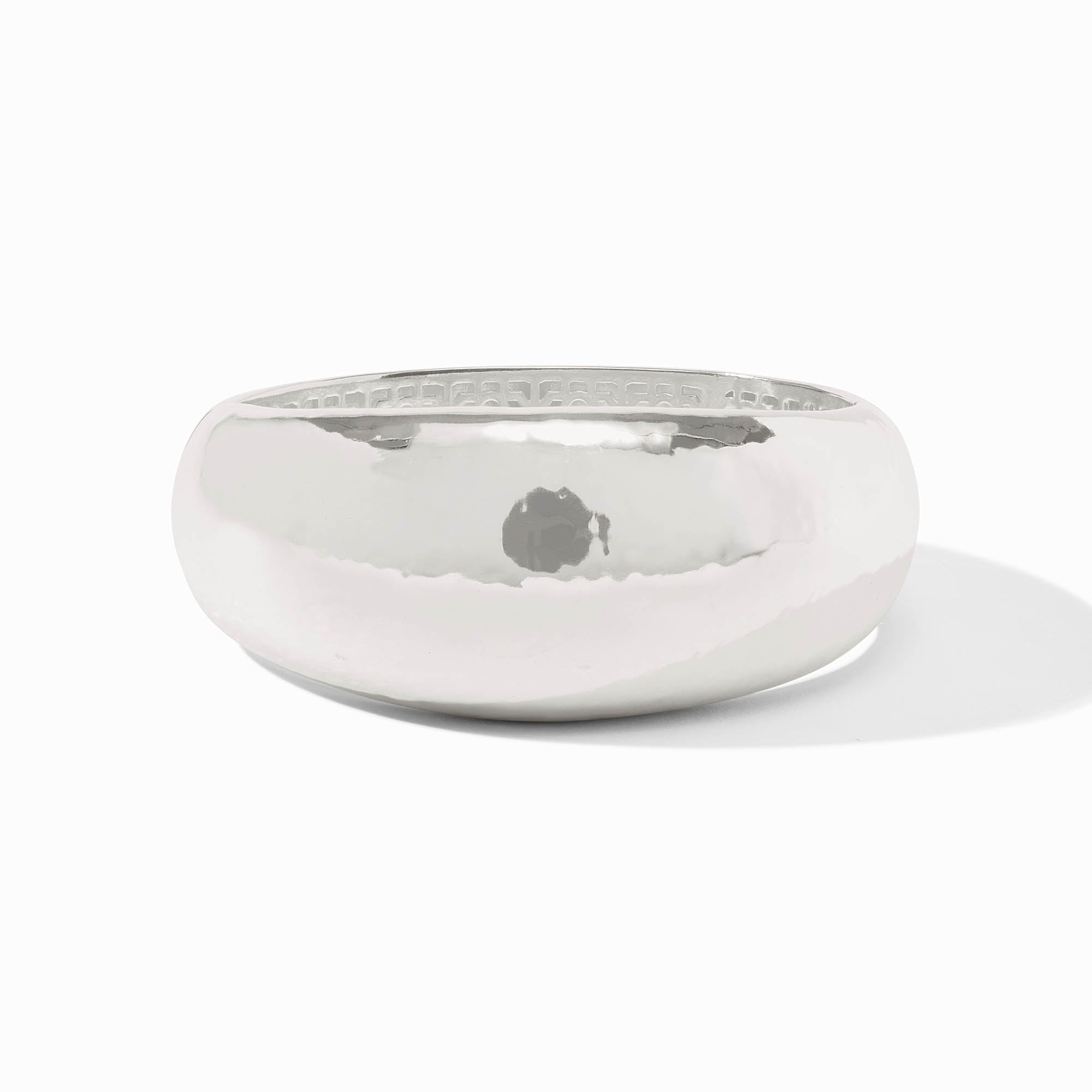 Silver plate statement bangle with a spring hinge closure