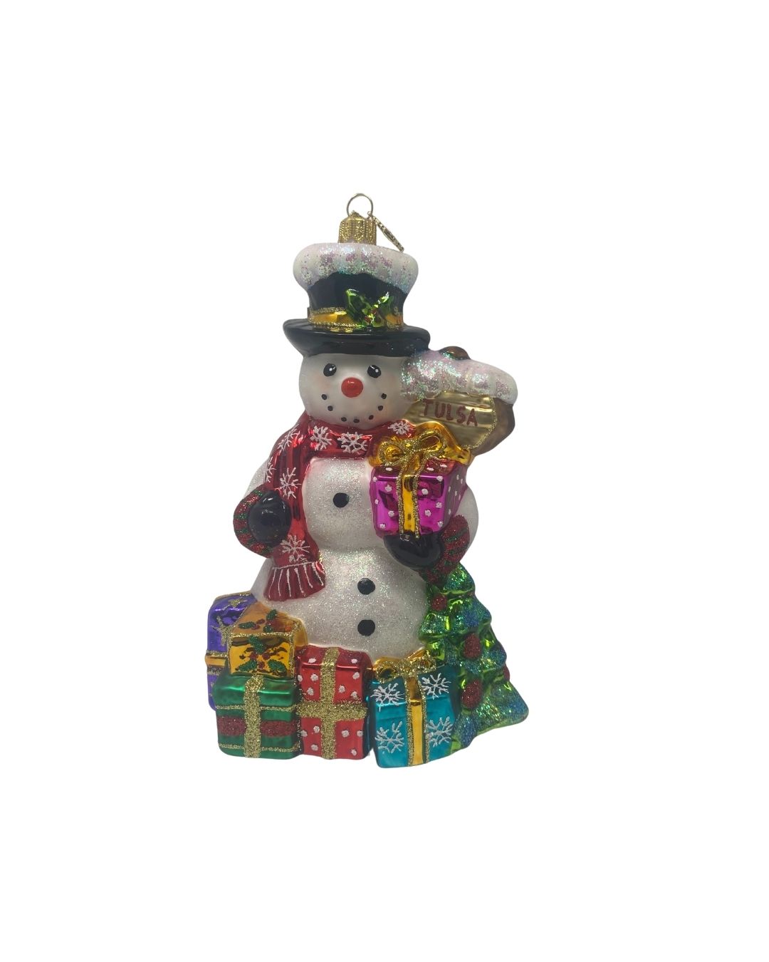 Glittery glass snowman ornament wearing a top hat and red scarf, holding gifts and a Tulsa bag.