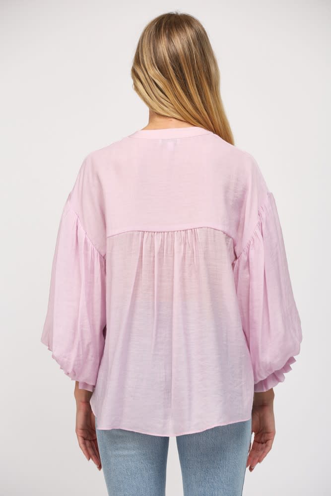 Diana button-down shirt in light blue with puff sleeves.