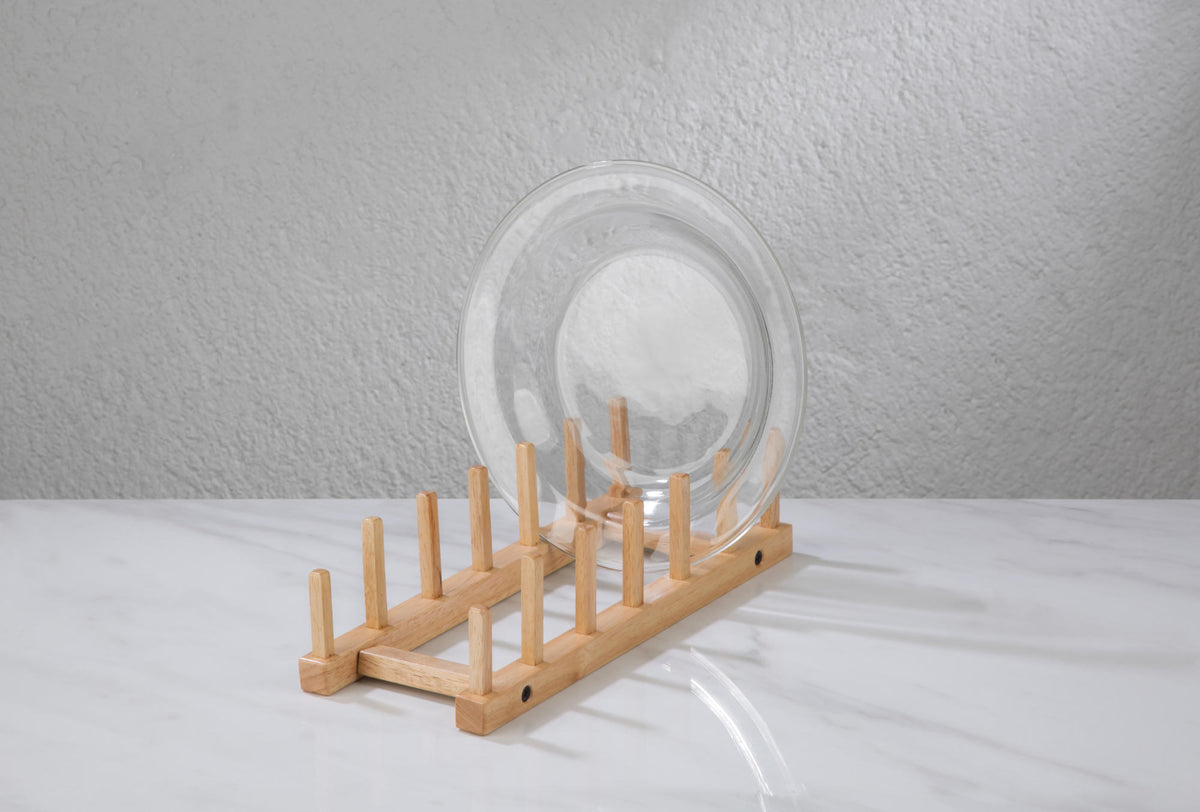 Wooden plate storage rack with square pegs holding up to six plates.