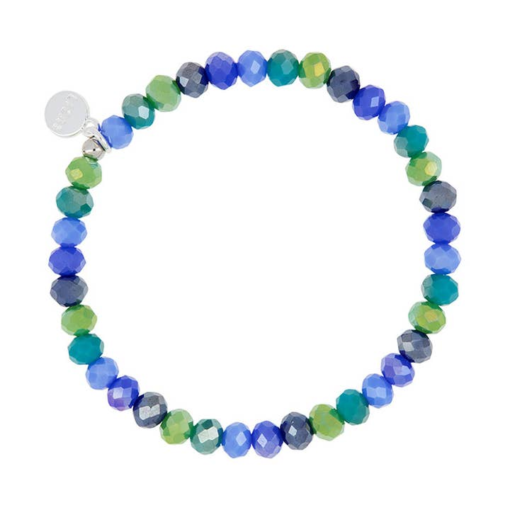 Nashville Creation Bracelet with faceted blue, green, and grey glass beads on an elastic band.
