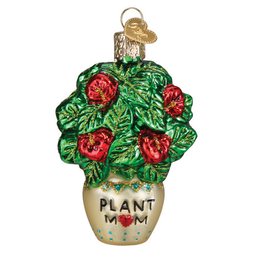 Glass Christmas ornament of a green leafy plant with red flowers in a pot labeled Plant Mom.