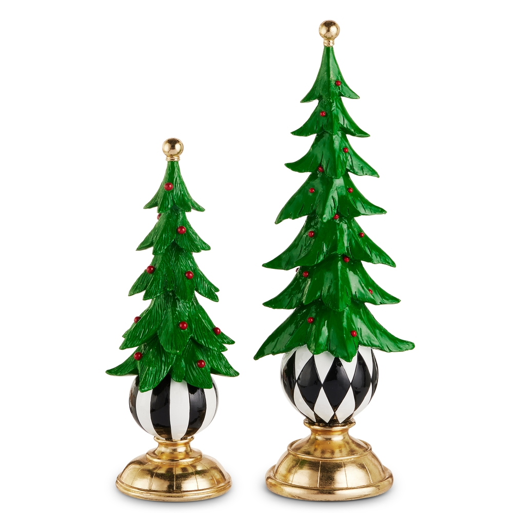 Two green resin Christmas trees with red berries on black and white patterned ball pedestals.