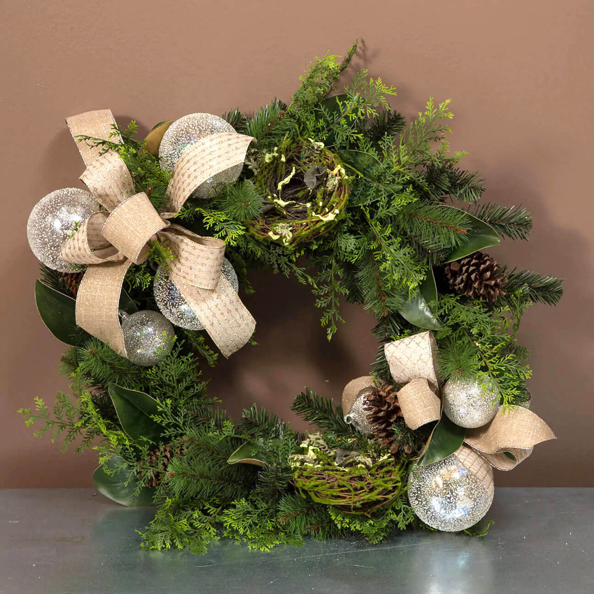 Clear glass spherical ornament with a textured surface measuring five inches wide.