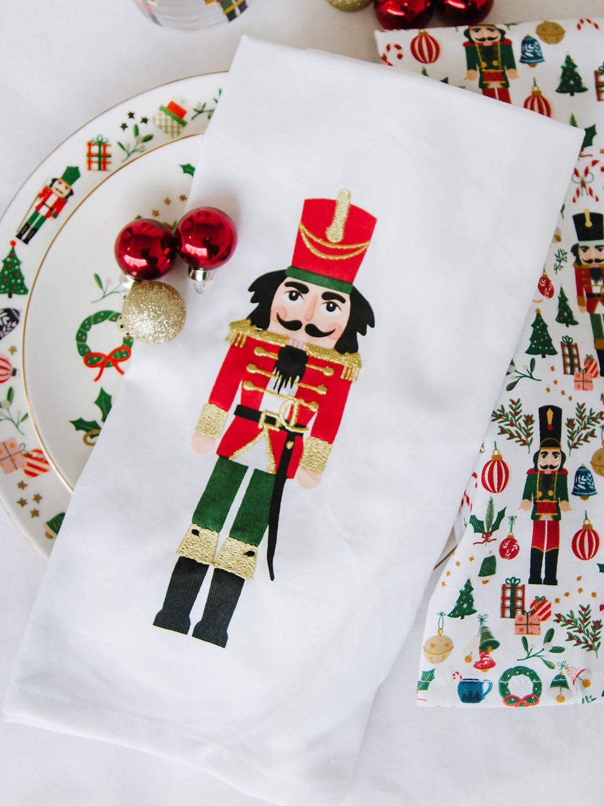 Traditional nutcracker tea towel with gold thread embroidery on cotton fabric