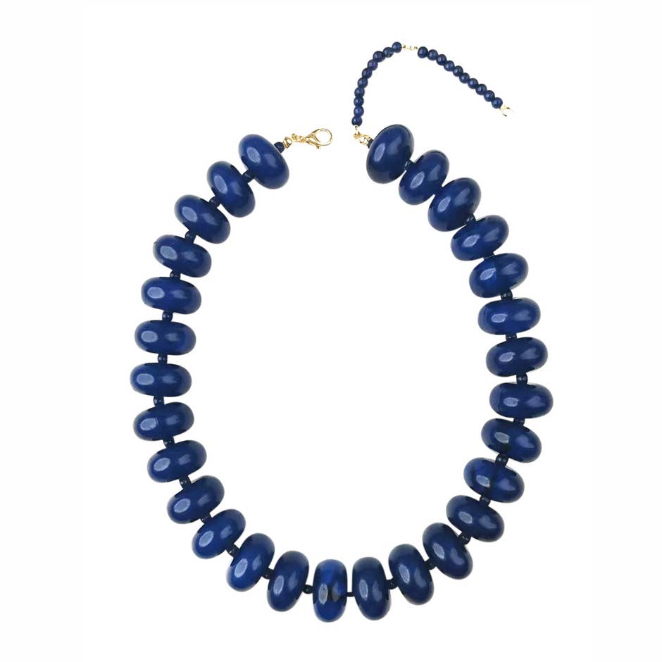 Bailey Chunky Beaded Necklace featuring large, glossy navy blue marbled beads with a gold clasp.