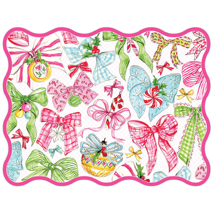 Die-cut paper placemat featuring a festive pattern of colorful bows, candy canes, and ornaments.