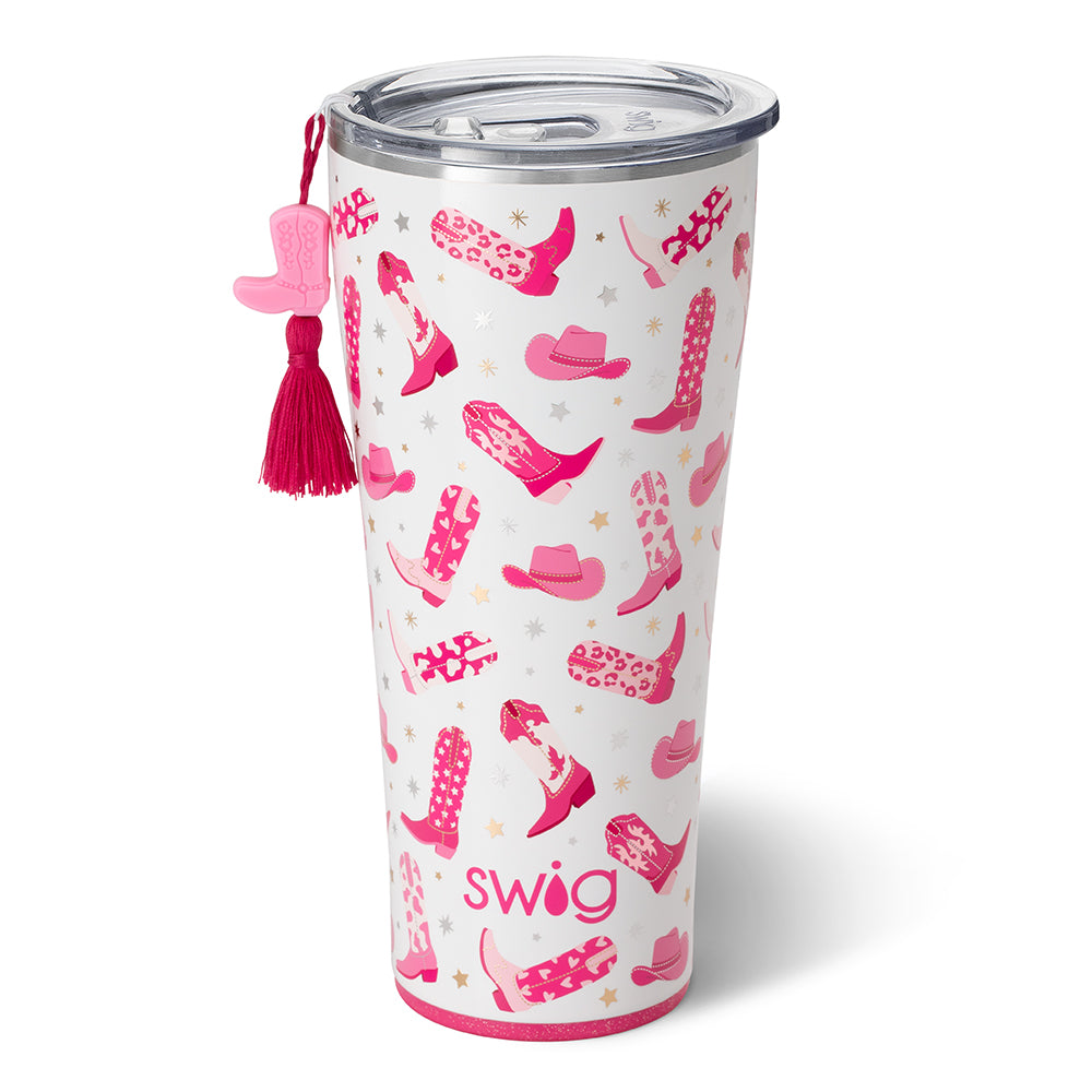 White 32oz stainless steel tumbler with pink cowboy boot and hat pattern and a boot charm.