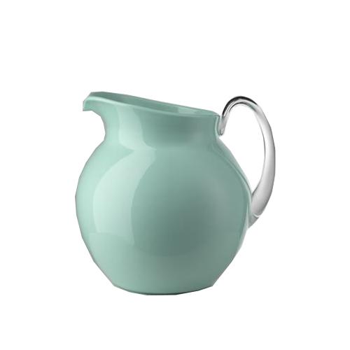Pale green ceramic pitcher with a clear glass handle and a rounded silhouette.