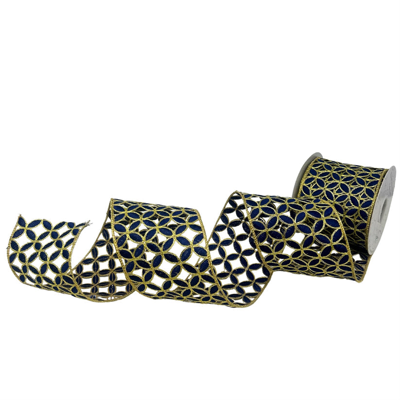 Four-inch wide navy blue ribbon with gold cutout patterns on a white background