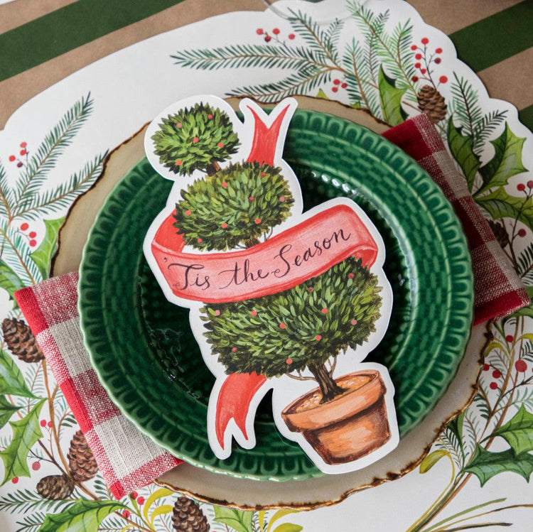 Holiday Topiary Table Accent featuring a three-tier topiary with a red 'Tis the Season' ribbon.