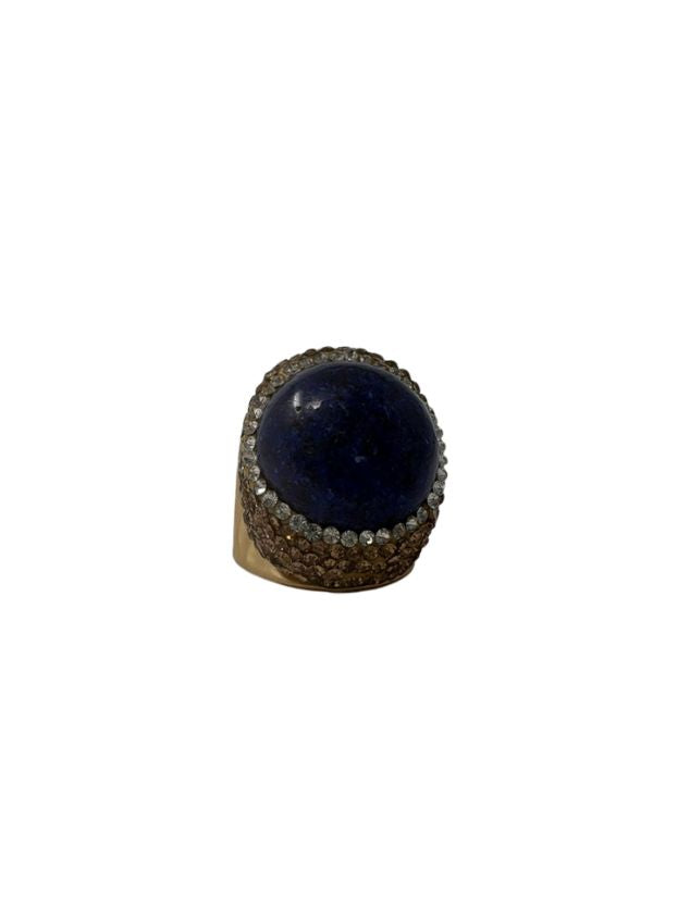 Queen of Sheba fashion ring featuring a large round blue stone surrounded by crystals.