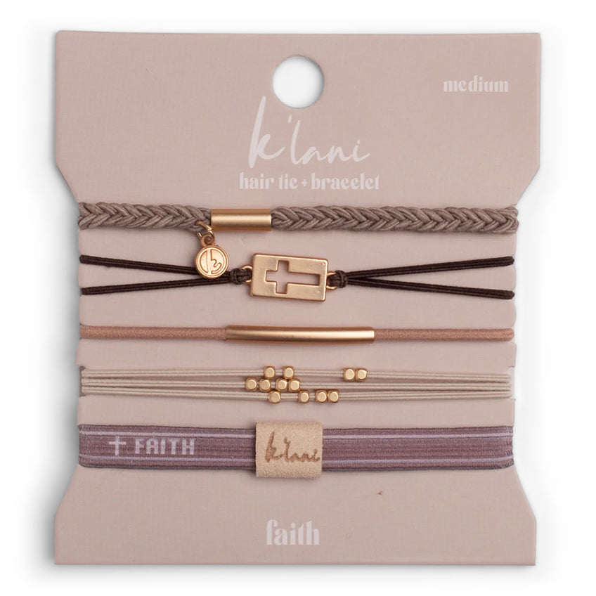 Set of five warm neutral hair tie bracelets with gold cross and bead accents on a pink card.