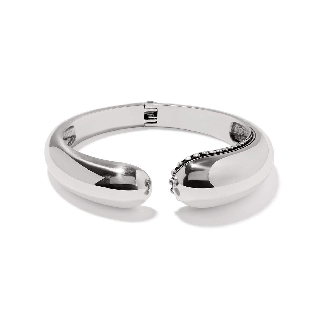 Silver plated Pretty Tough Droplet Hinged Bangle with a polished finish and beaded detail.