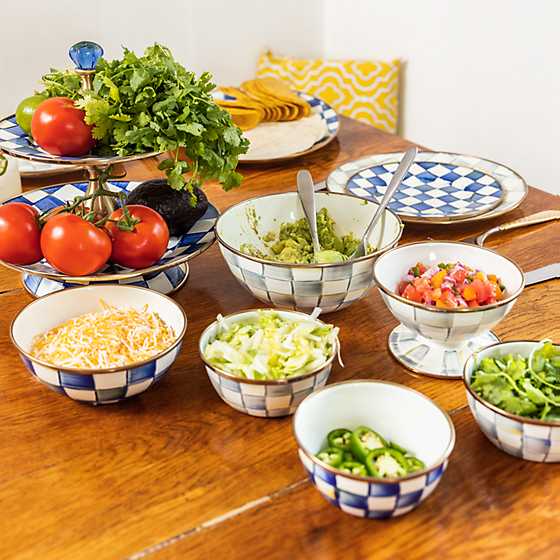 Sterling Check Enamel Everyday Bowls filled with taco toppings on a wooden table.