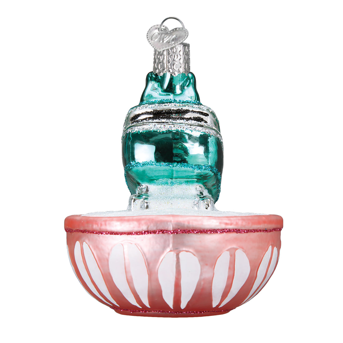 Glass hand mixer ornament with a teal body and pink mixing bowl base with white petal details.