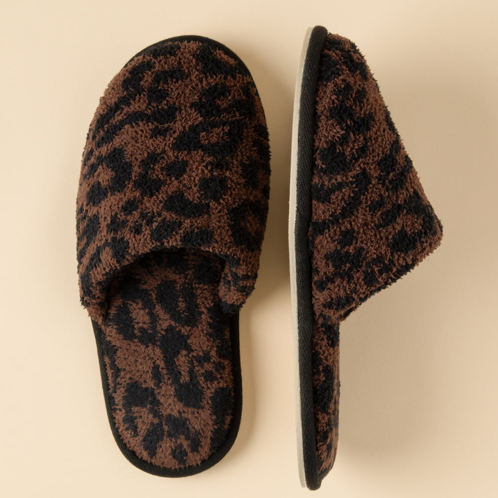 Slip-on leopard print slippers with plush knit lining and cushioned insole.