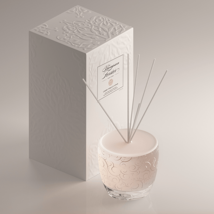 Cherry Tobacco Affair reed diffuser bottle with amber liquid and wooden sticks