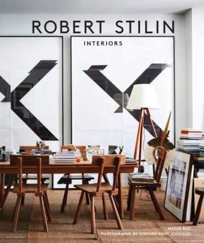 Robert Stilin Interiors book cover featuring a dining room with wooden chairs and large black and white art.