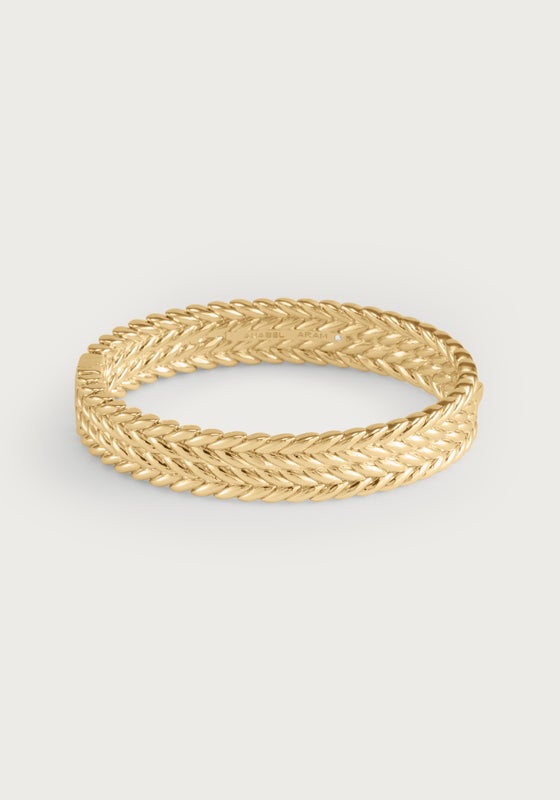 Thick 18K gold plated brass hinged bangle with a textured braided reins motif.