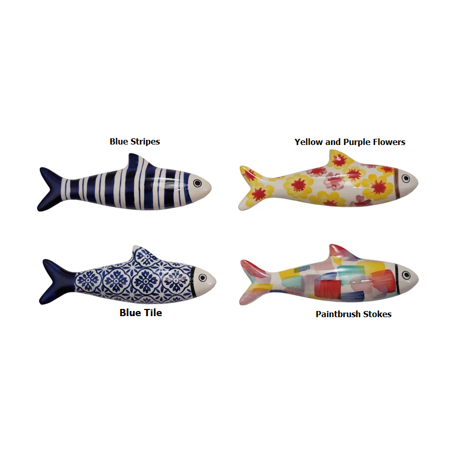 Hand-painted stoneware fish wall décor in blue glaze with white scale pattern and natural clay body.