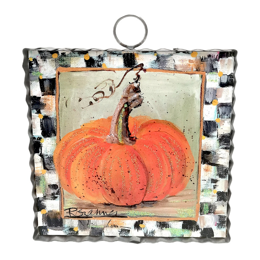 Mini art piece featuring a painted orange pumpkin with a black and white checkered border.