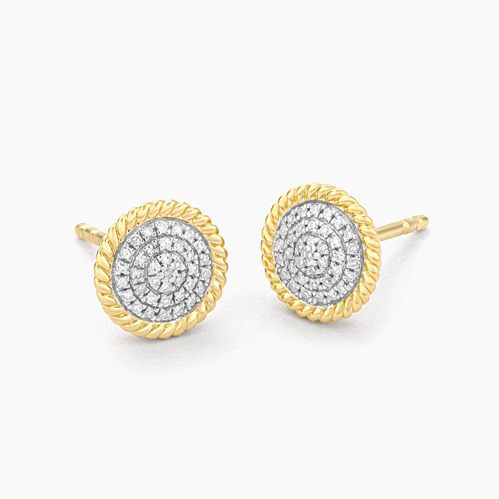Two-tone circle rope stud earrings featuring a diamond-encrusted center and gold rope border.
