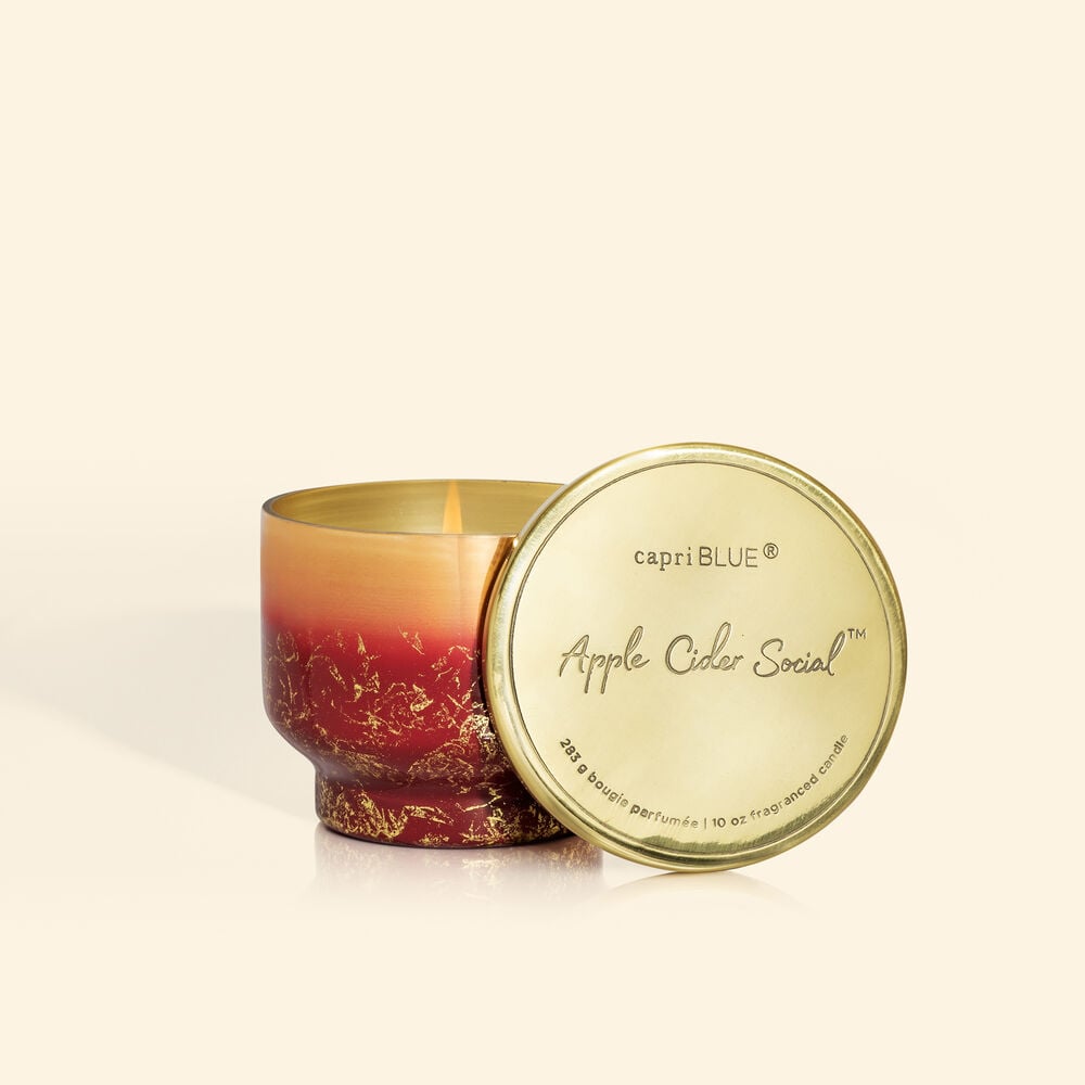 Inverted jar candle in Glimmer apple cider scent with a clear glass silhouette and visible wick.