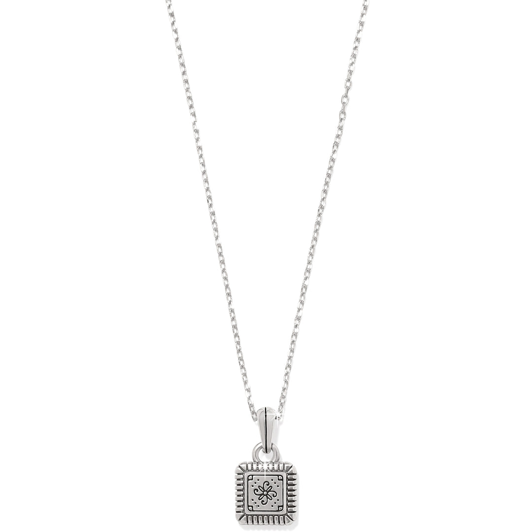 Silver and gold two-tone mini tile necklace with a mosaic pendant on a delicate chain.