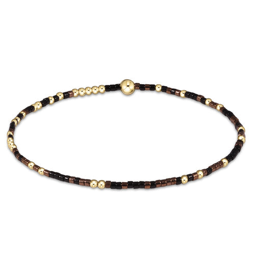 Hope Unwritten bracelet featuring mixed 2mm seed beads in various colors with gold-filled accents on elastic cord.