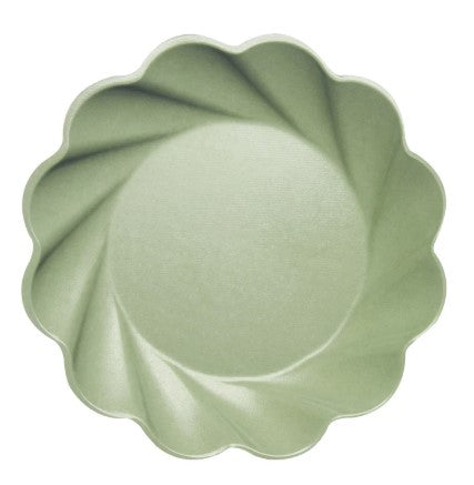 Wavy eco-friendly dinner plate made from bamboo fiber blend in natural beige tone.