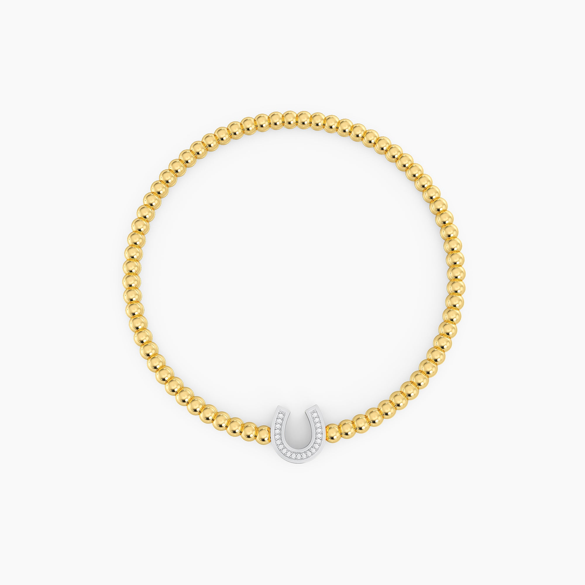 Gold beaded bracelet featuring a silver horseshoe charm set with small white diamonds.