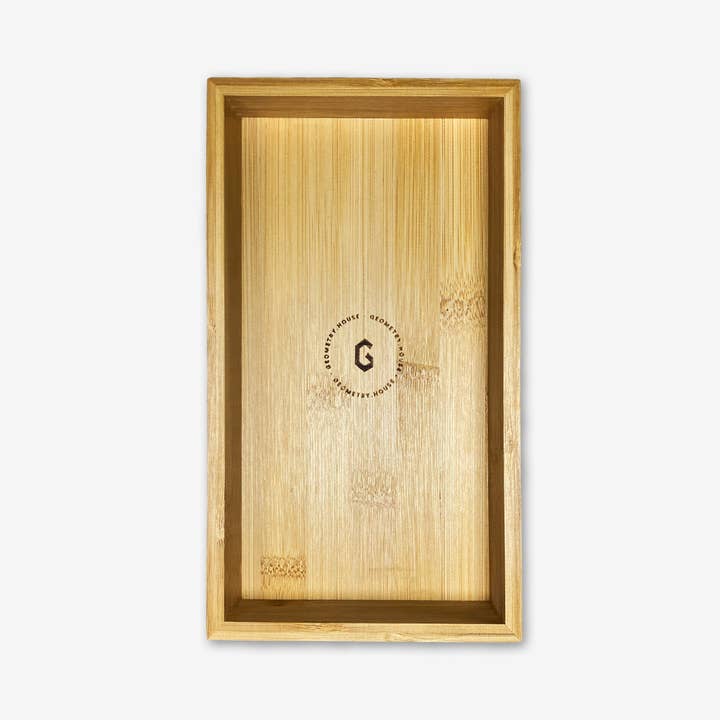 Rectangular bamboo tray with a natural wood grain and a circular logo in the center.