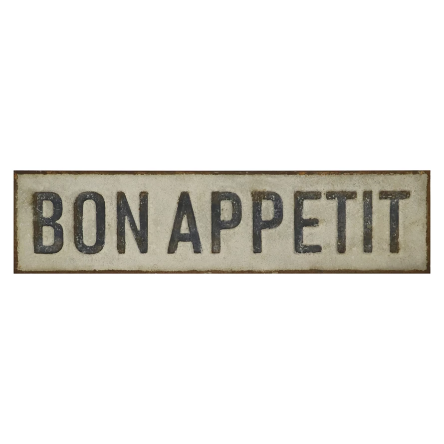 Rectangular embossed metal wall décor with a distressed finish featuring the words BON APPETIT.