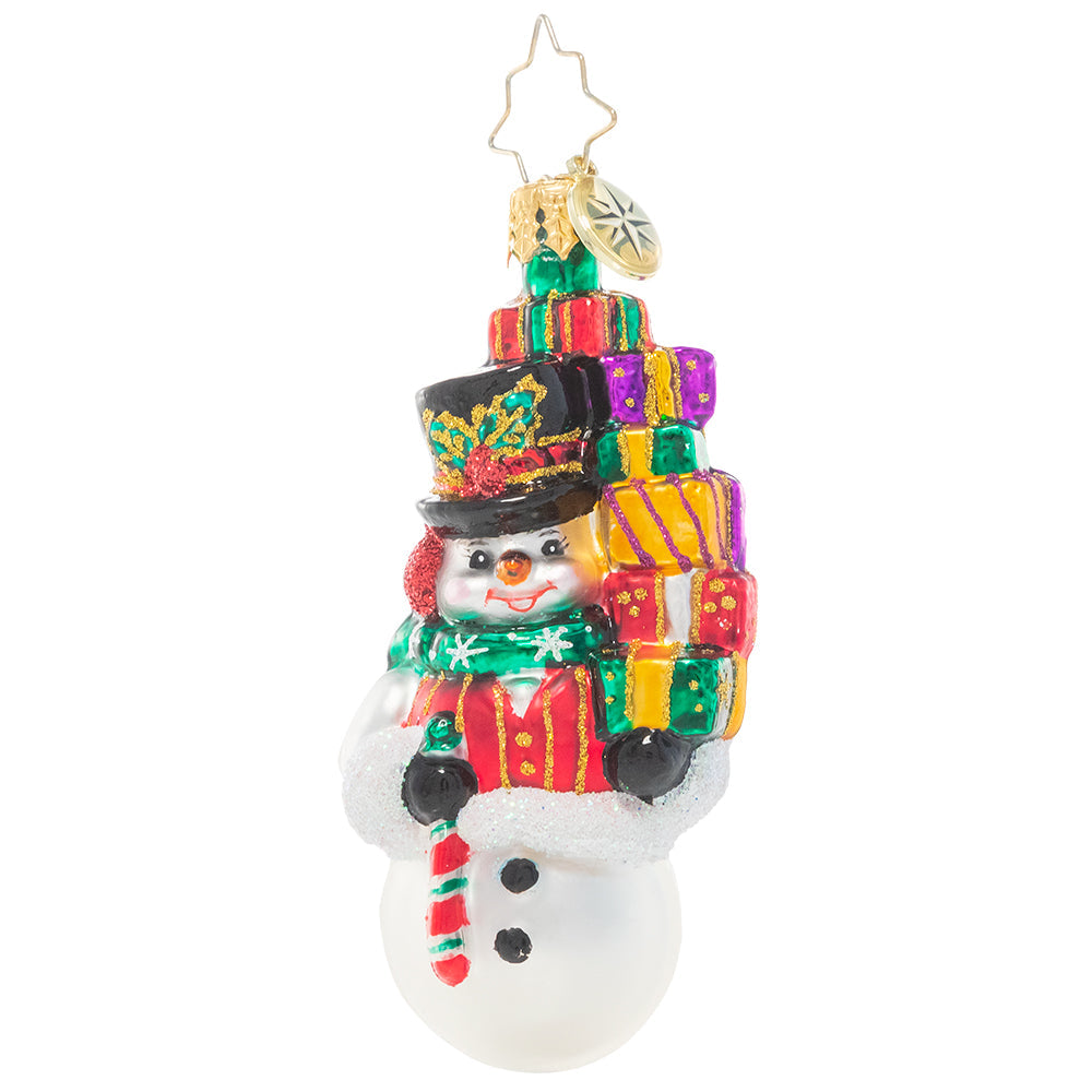 Savvy Shopper Gem snowman glass ornament holding a stack of colorful gifts and a candy cane.
