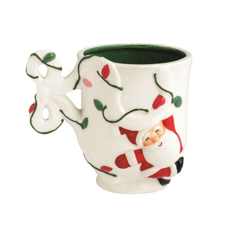 White ceramic Bow Christmas Mug with a raised Santa icon and a bow-shaped handle.