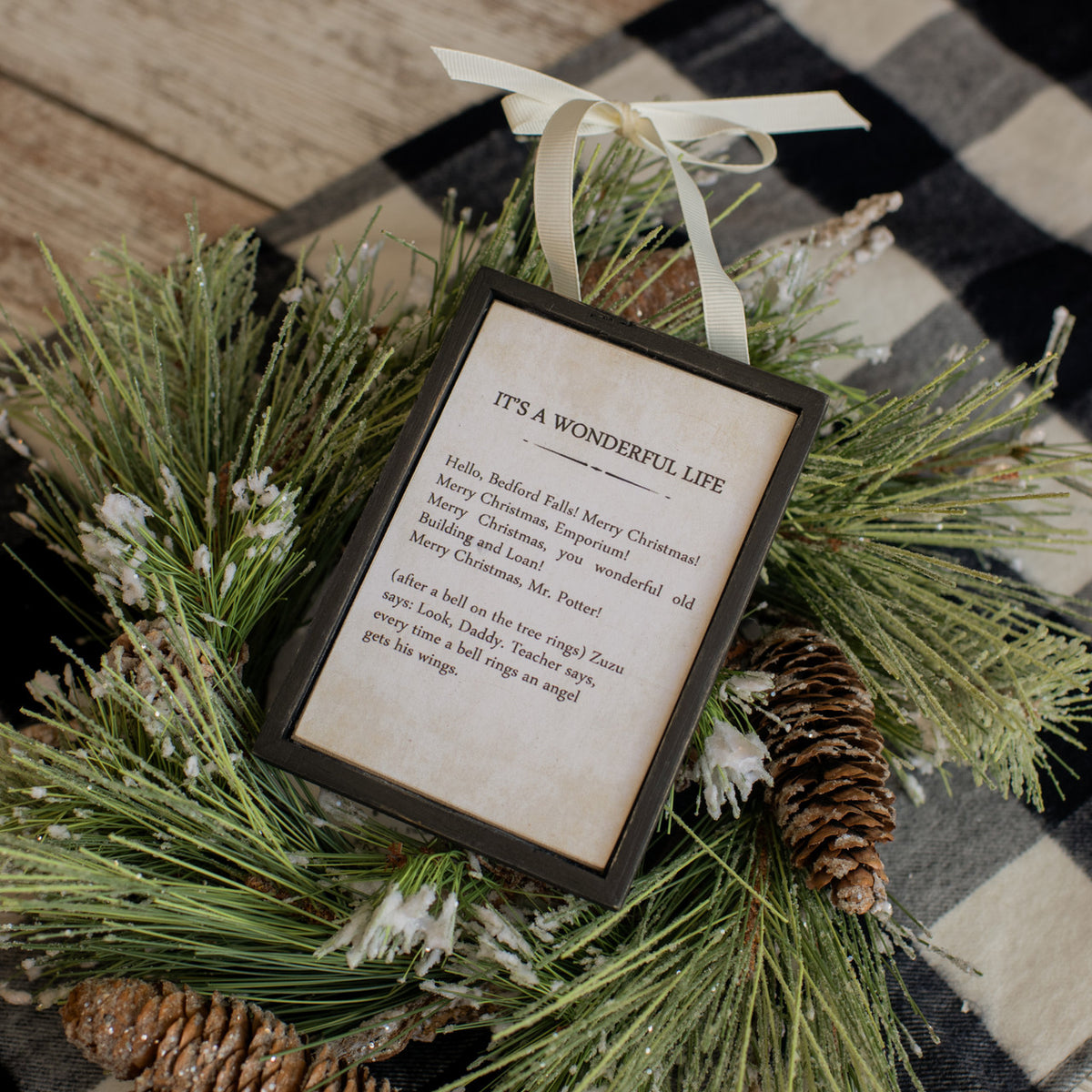 Wooden sign ornament shaped like a stylized letter S with natural grain texture.
