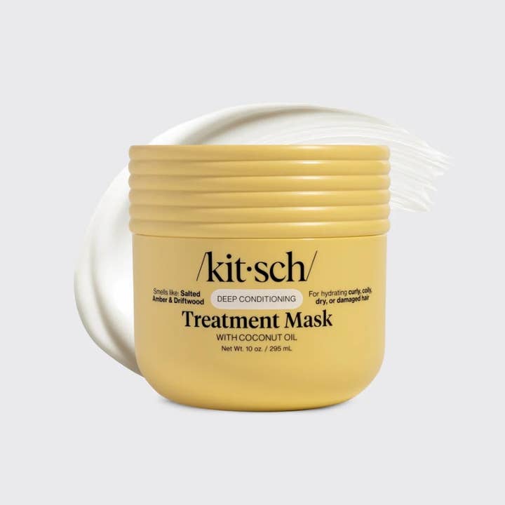 Front view of a Moisturizing Coconut Oil Deep Conditioning Treatment Mask bottle with white label and black cap.
