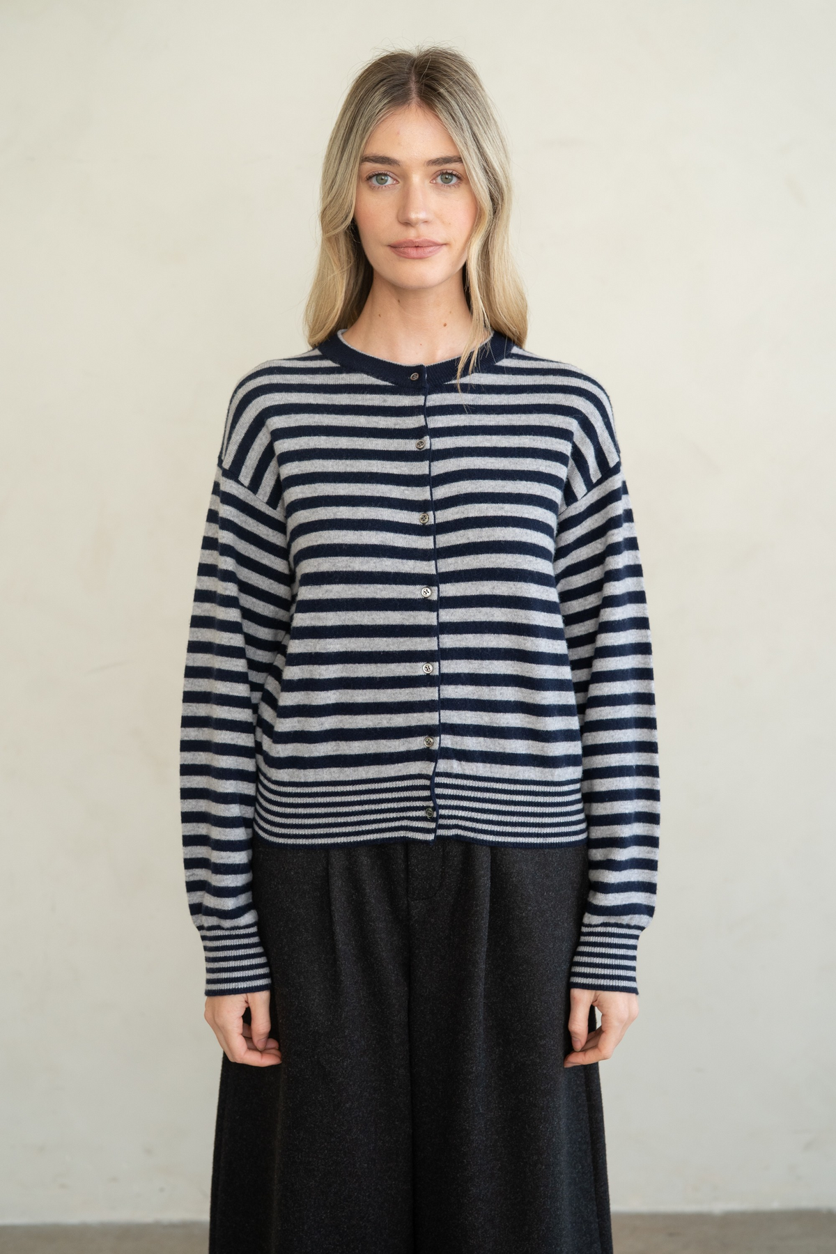 Woman wearing a navy and grey Marian Striped Button Front Cardigan with a crew neck.