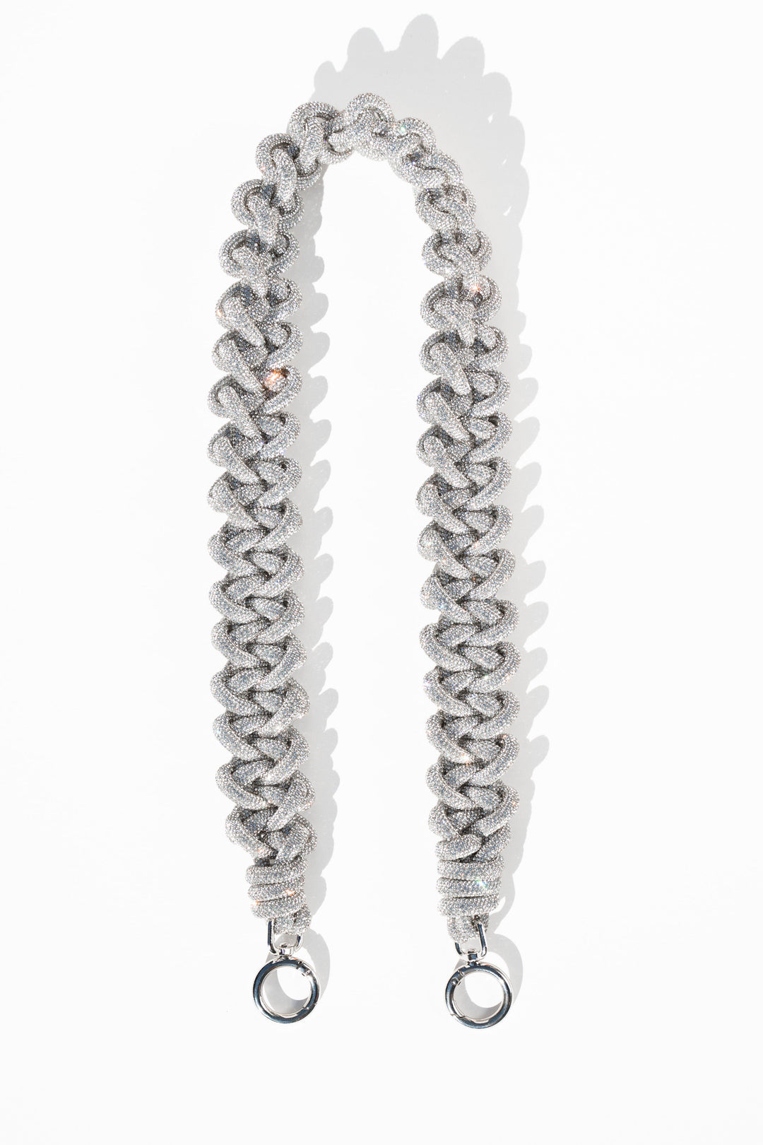 Black leather lace strap with metal hooks designed to attach to bags